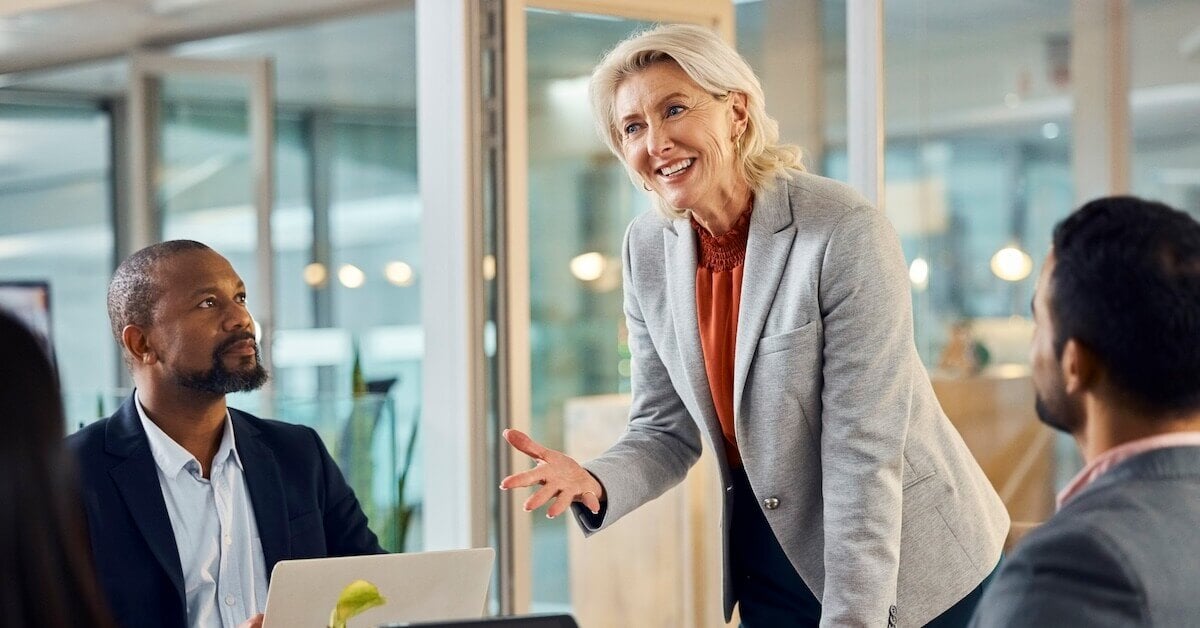 A senior executive speaks during a sales meeting.