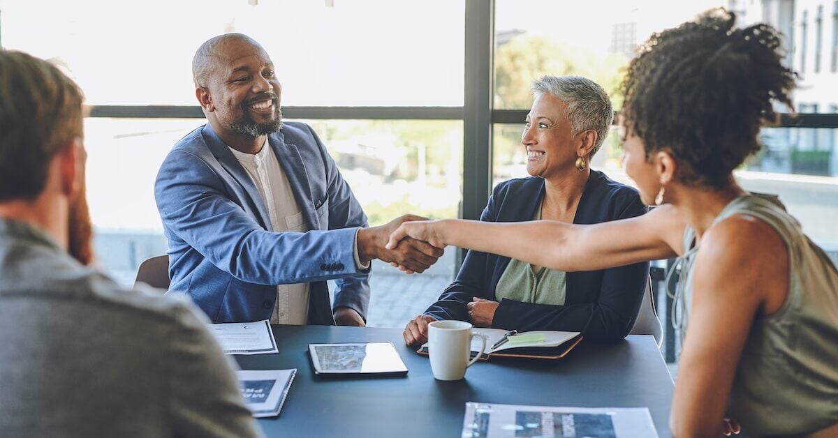 A seller closes out a successful sale with a handshake.